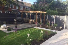 North-facing garden with sunny patio